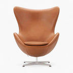Brown leather egg chair on a white background