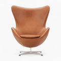 Brown leather egg chair on a white background