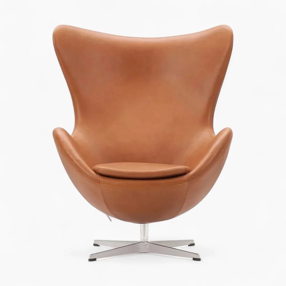 Brown leather egg chair on a white background